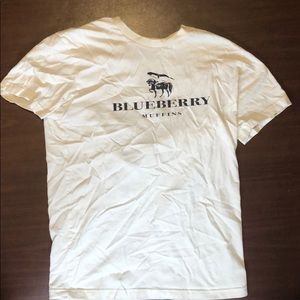 Short sleeve cream colored shirt.